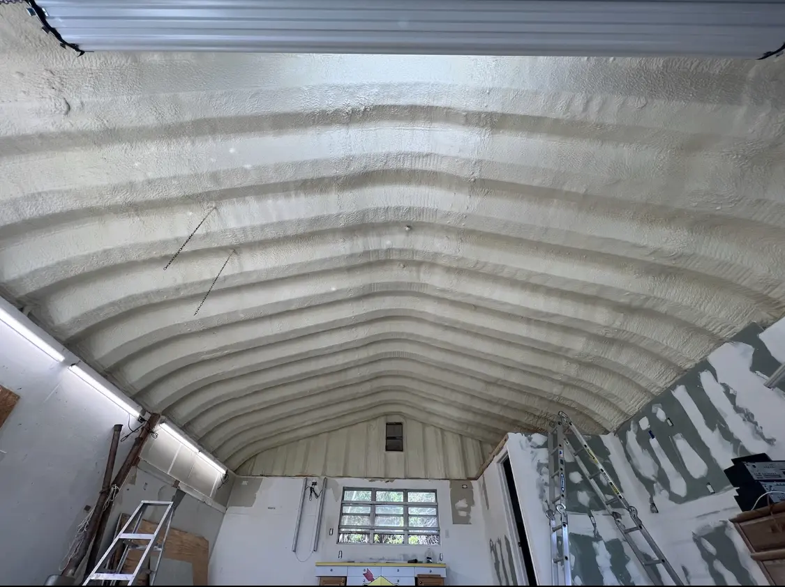 Spray polyurethane foam applied to the underside of a metal roof deck in Detroit Lakes